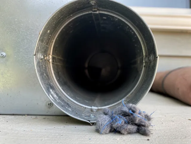 Wickliffe Dryer Vent Cleaning technician using specialized equipment to clear severe dryer vent blockage in Wickliffe